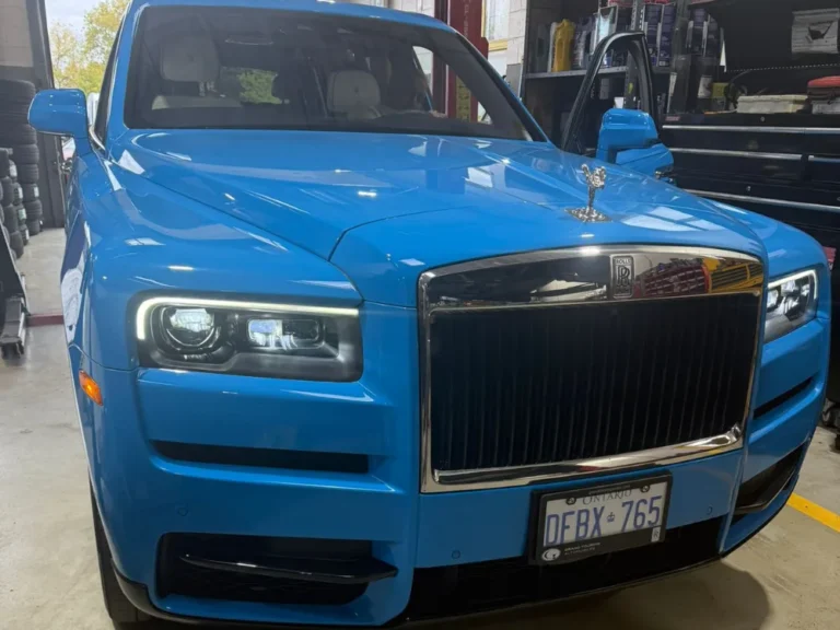 Front view of a blue Rolls-Royce Cullinan